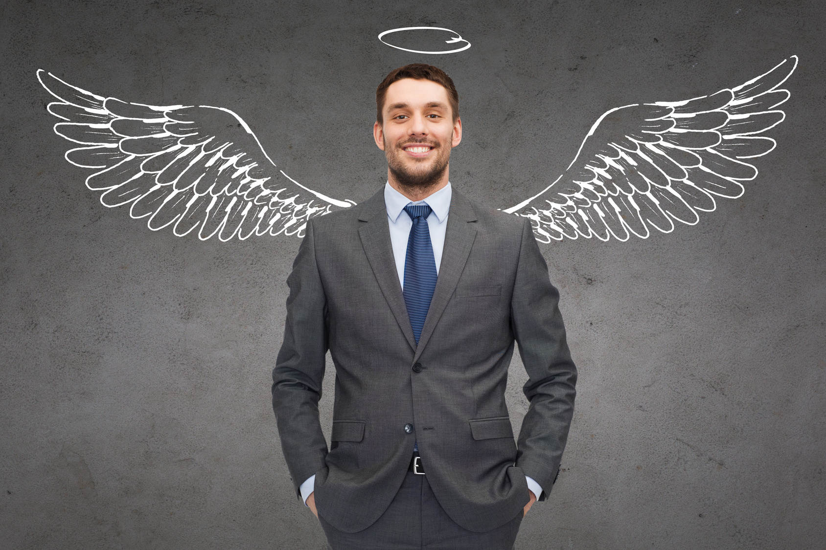 smiling businessman with angel wings and nimbus