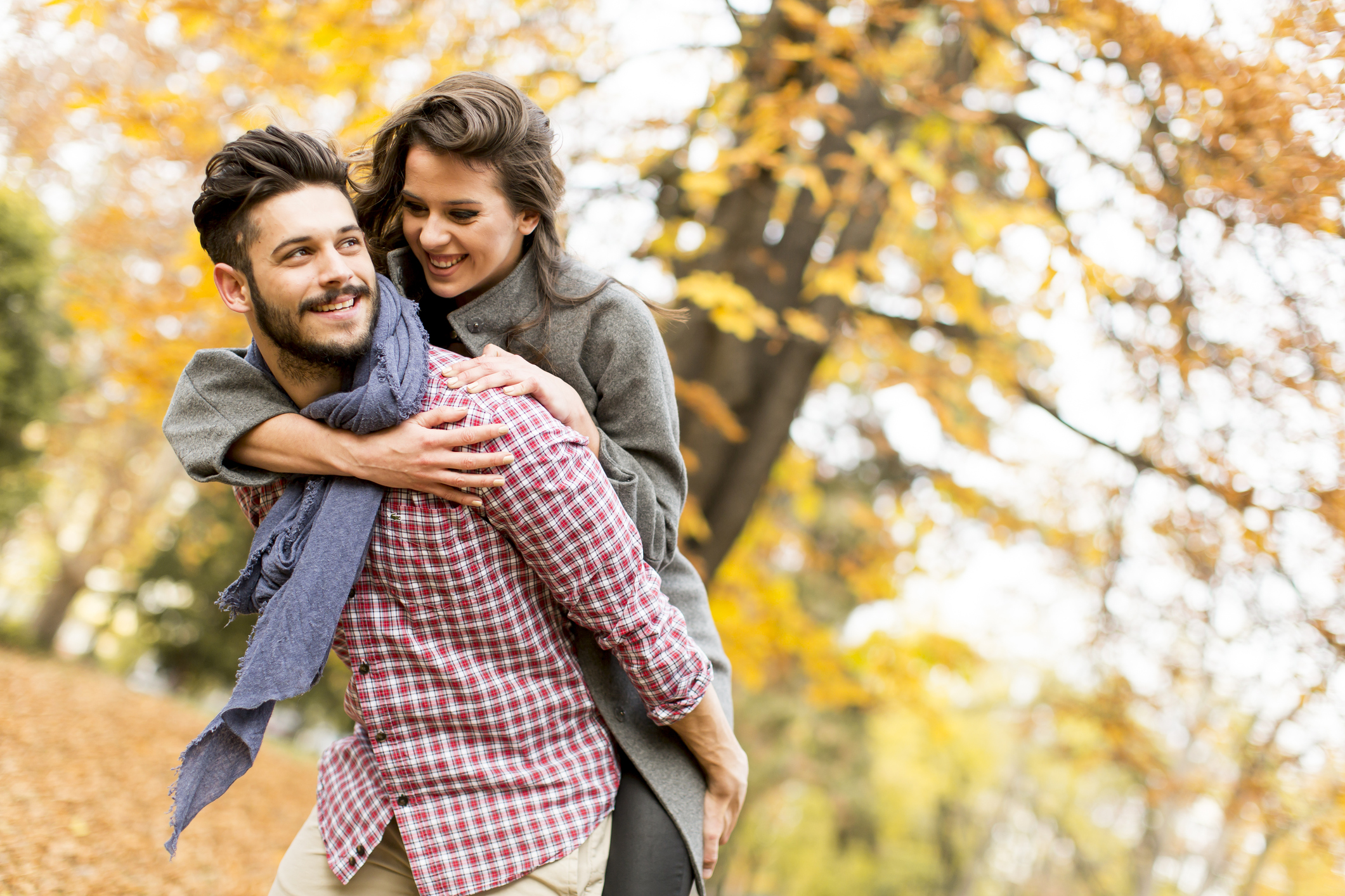 Young couple in the autumn forest