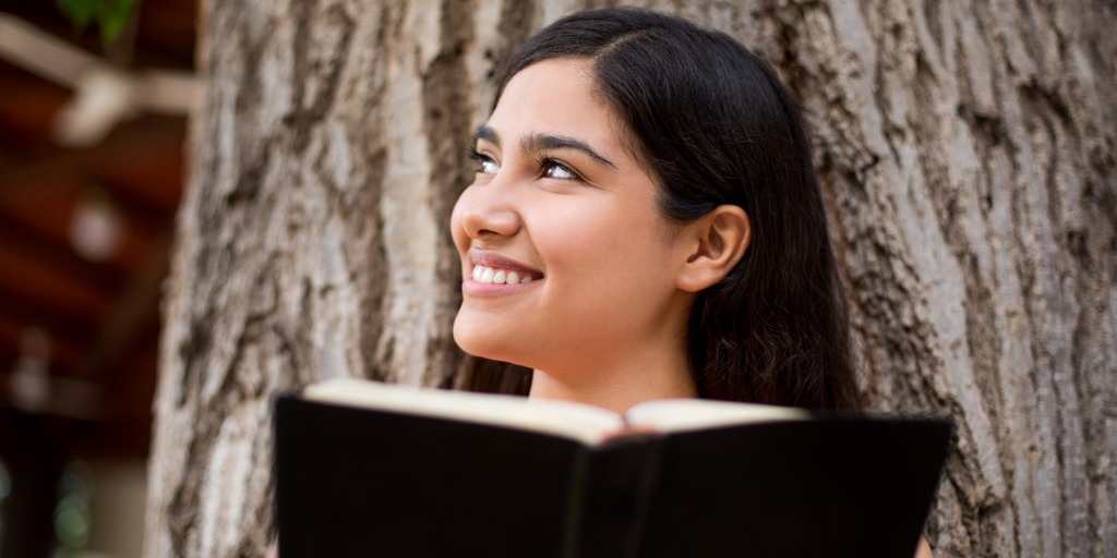 beautiful-young-lady-with-bible-in-hands-picture-id540218976