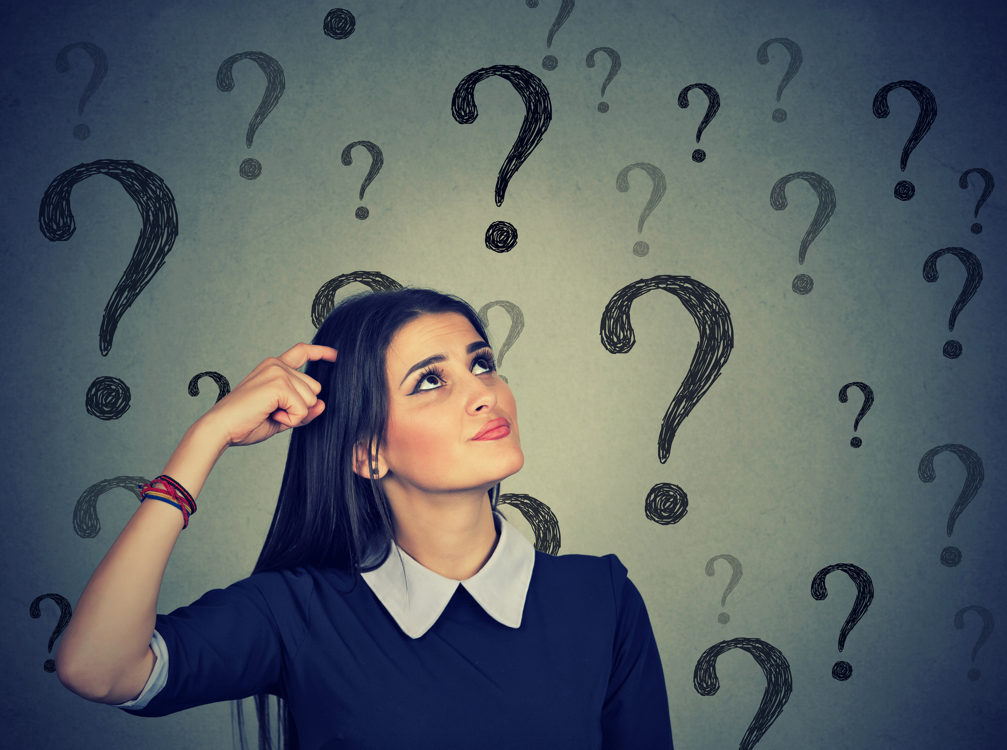 confused thinking young woman bewildered scratching her head