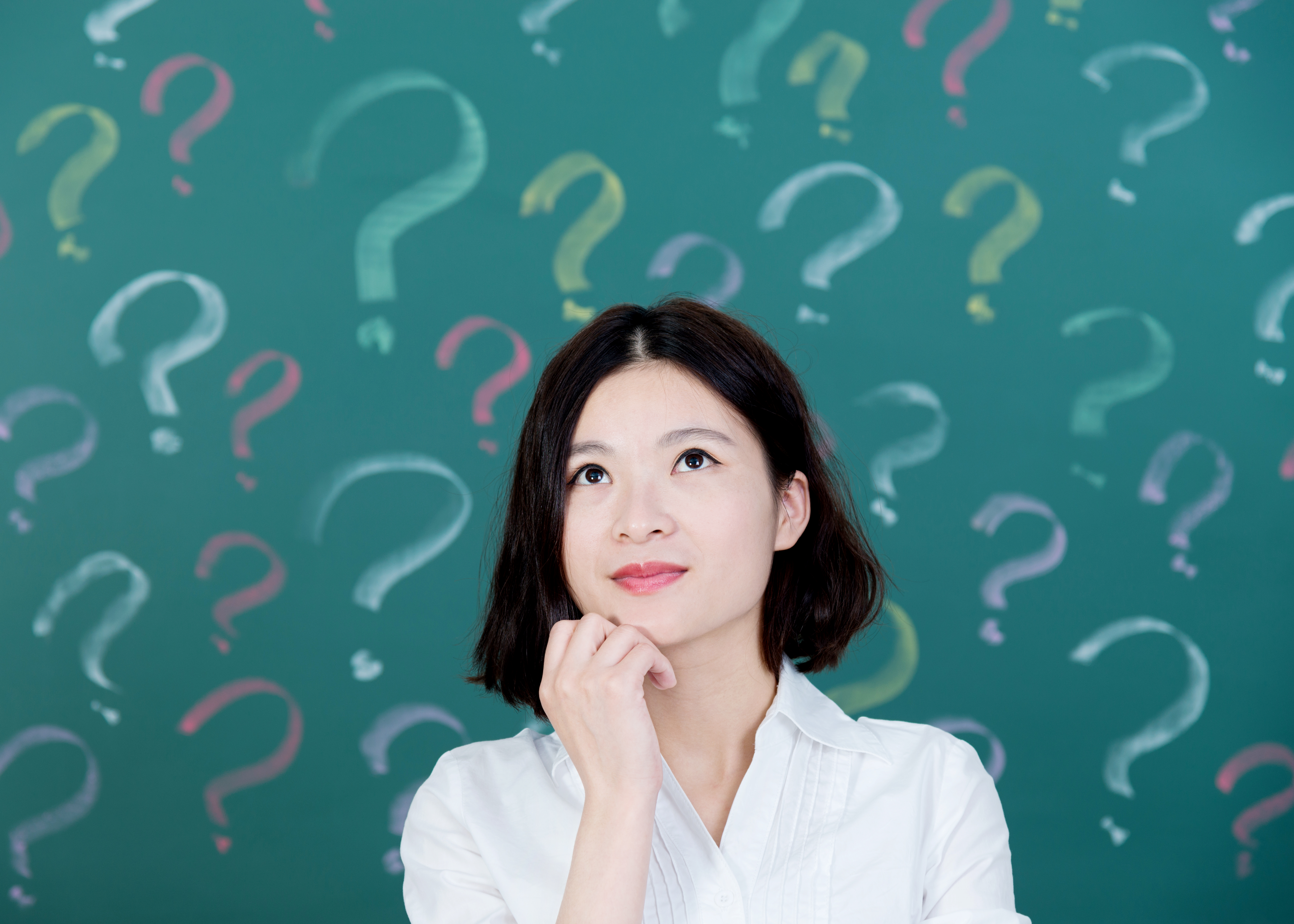 Young woman with question mark