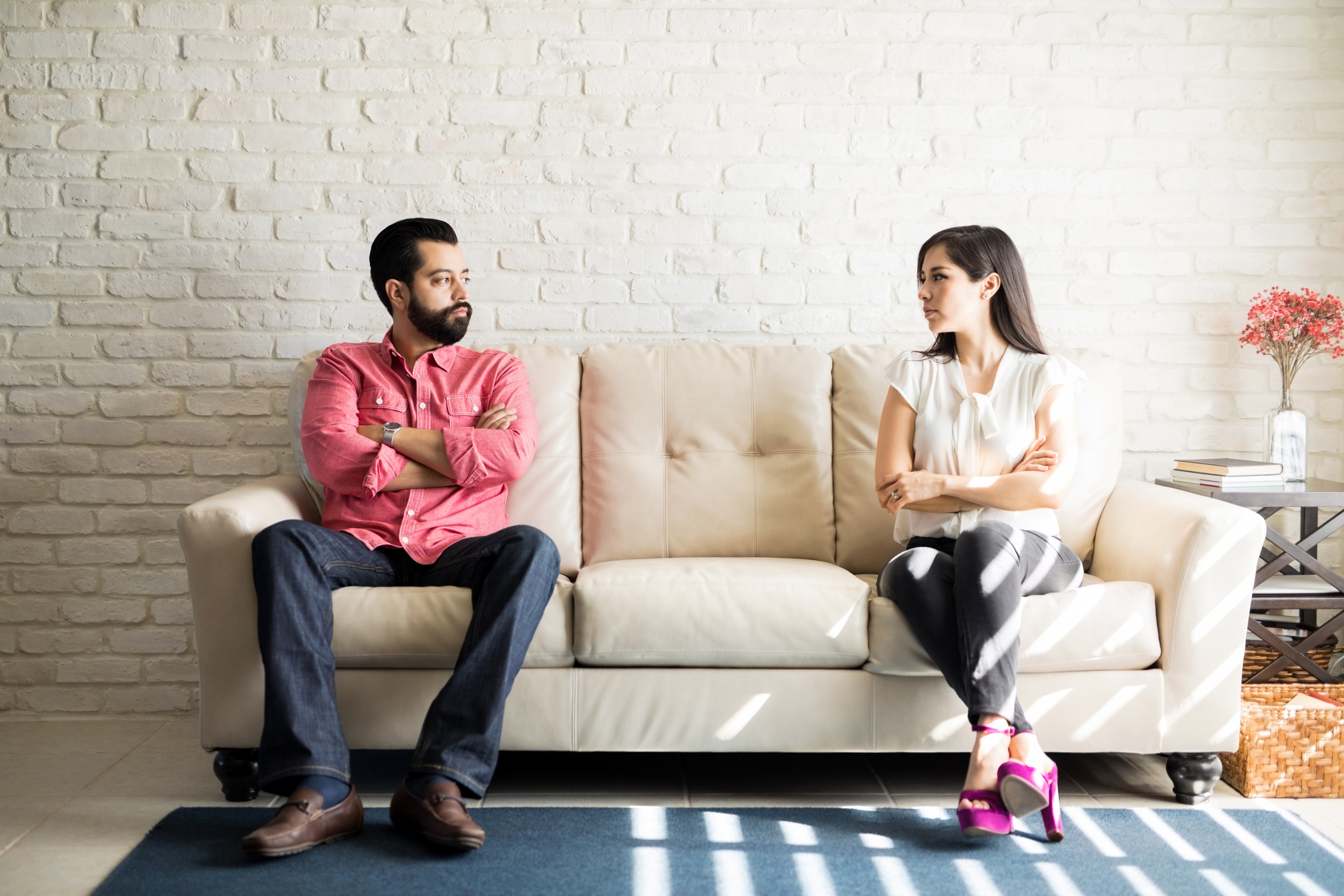 Disputed couple staring at each other with anger
