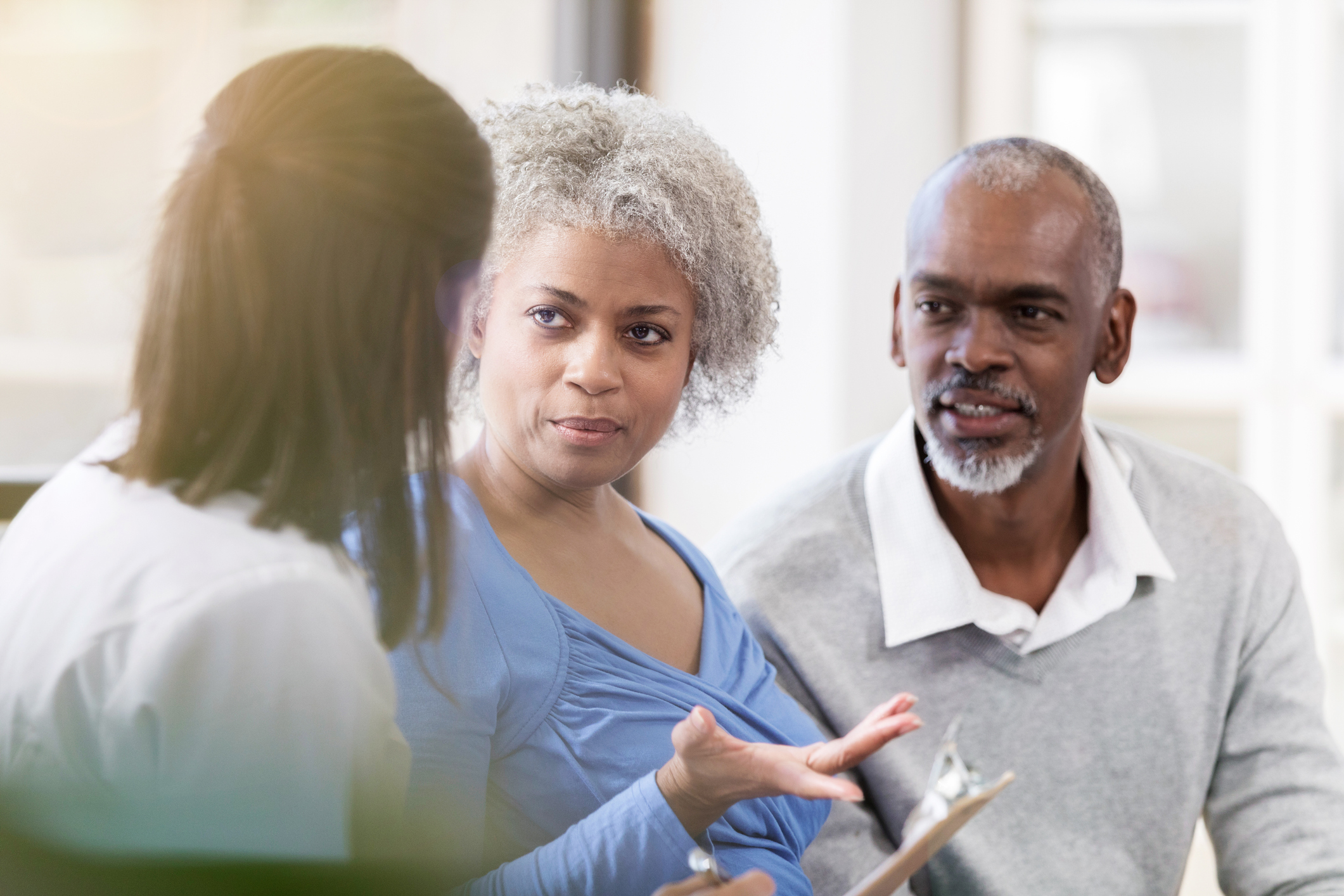 Senior woman discusses diagnosis with female doctor