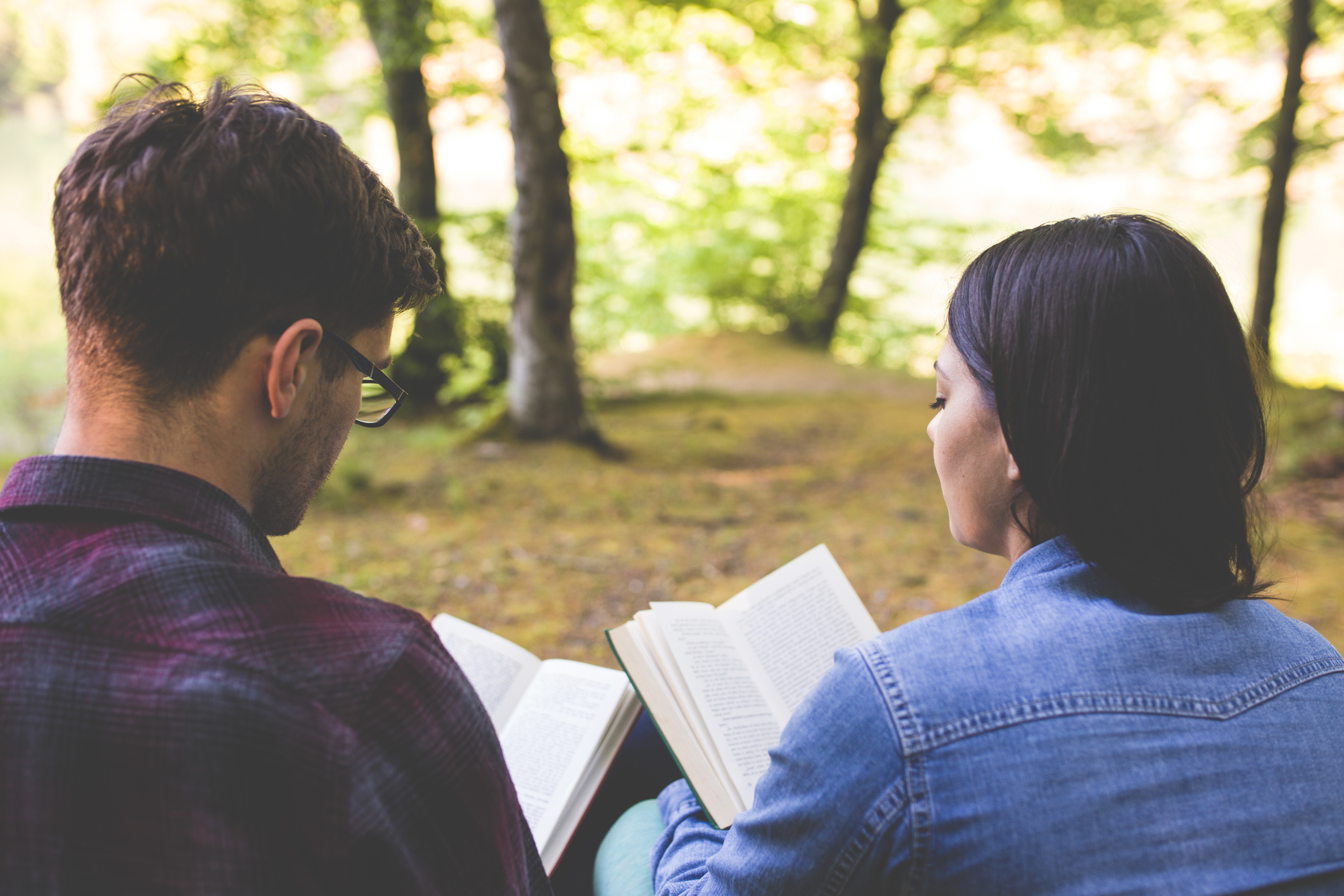 Couple Reading a Book On a Picnic