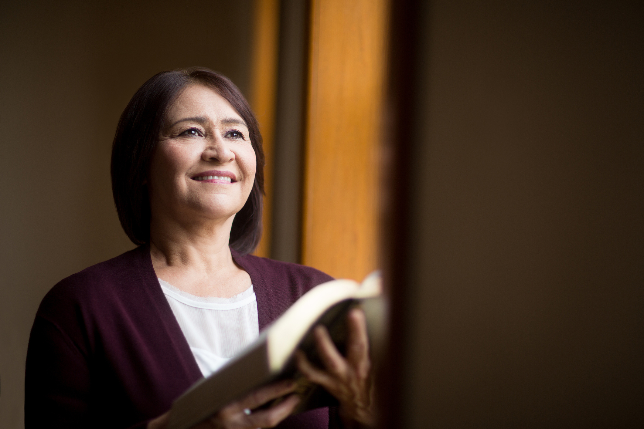 Mature woman reading book