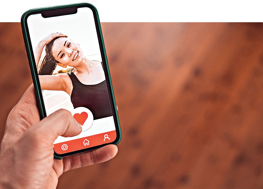 Online dating. Social media app on a device screen
