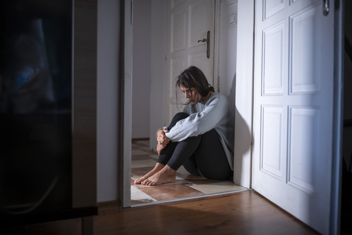 Woman Having A Mental Breakdown Sitting On The Floor