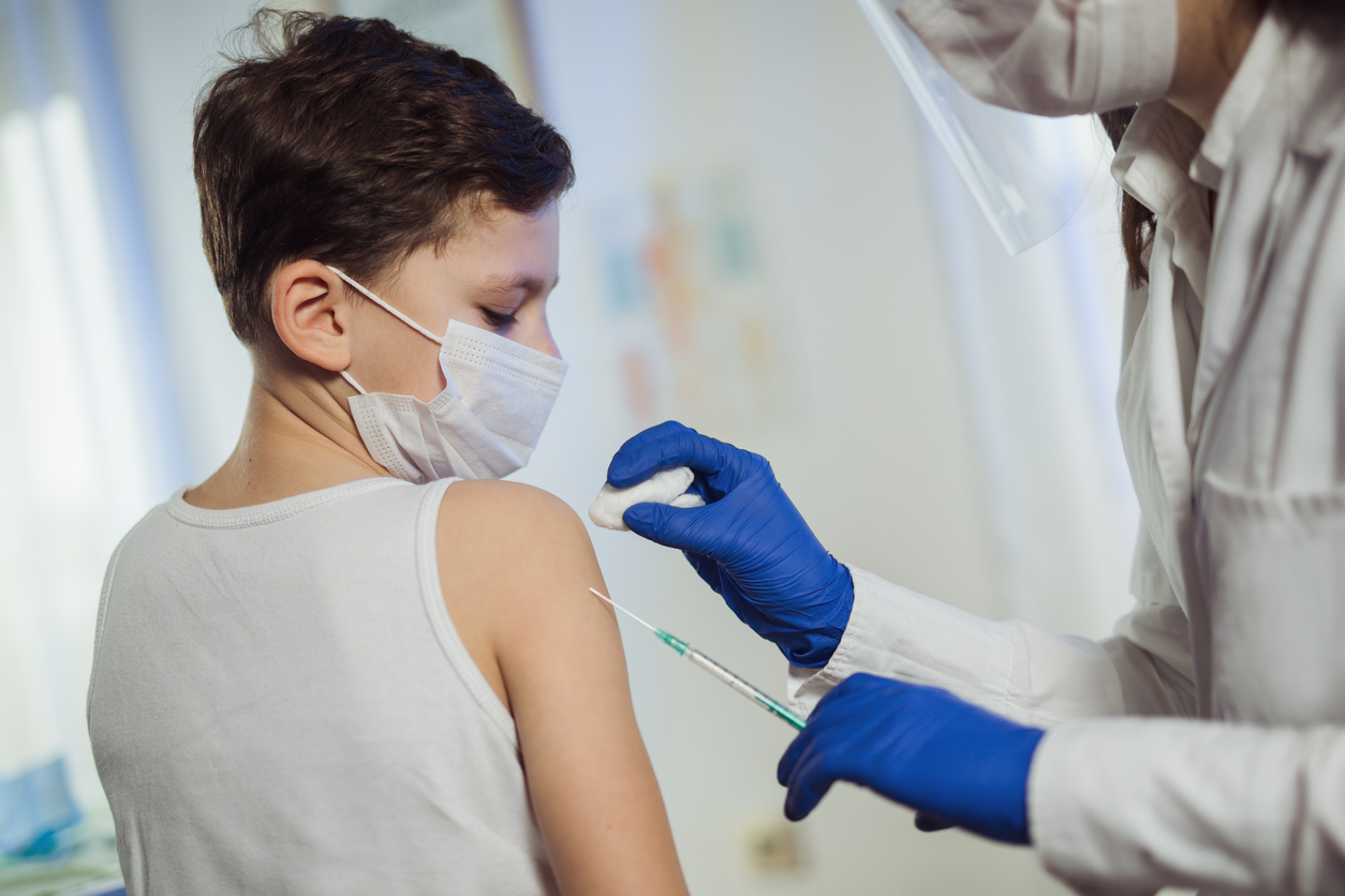 Search by image Little boy getting vaccinated at the Pediatrician&#8217;s office