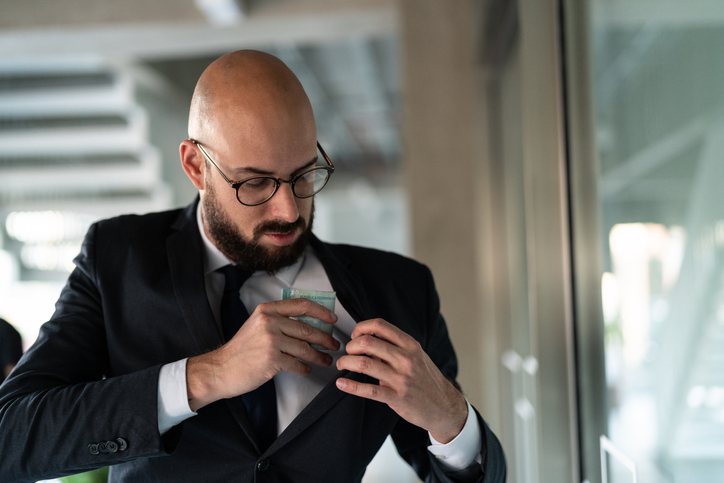 Brazilian Business man hiding brazil currency – Real