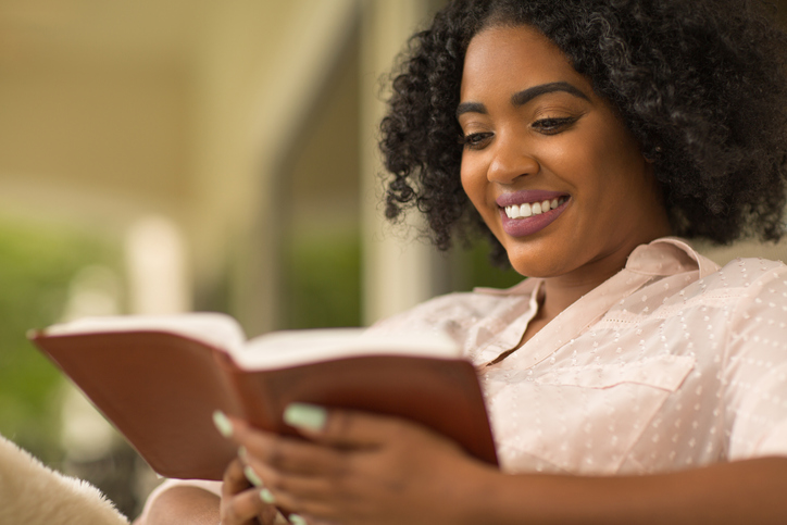 Happy woman reading.