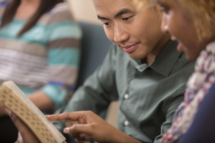 Multi-ethnic, mixed age bible study group.