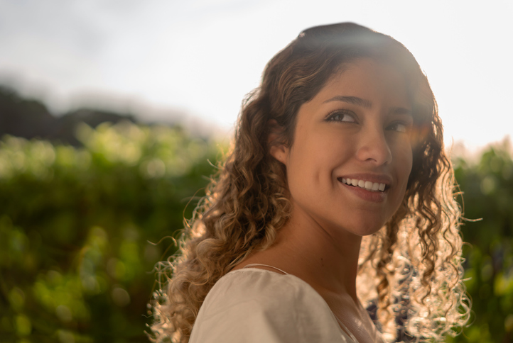 Portrait of a beautiful woman at a vineyard