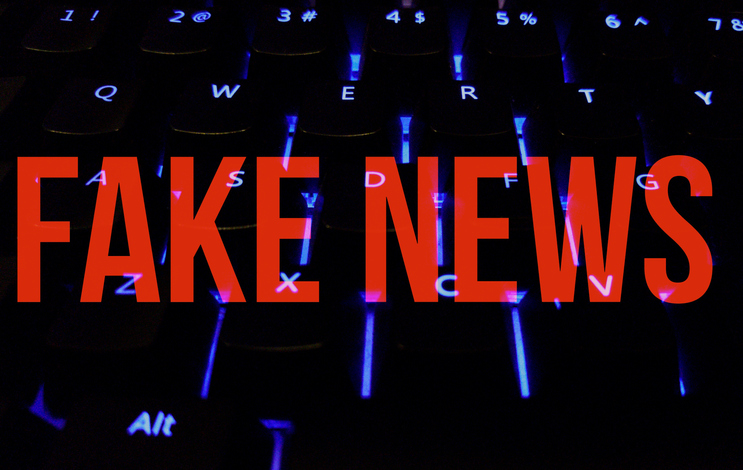 Fake news written on keyboard illuminations