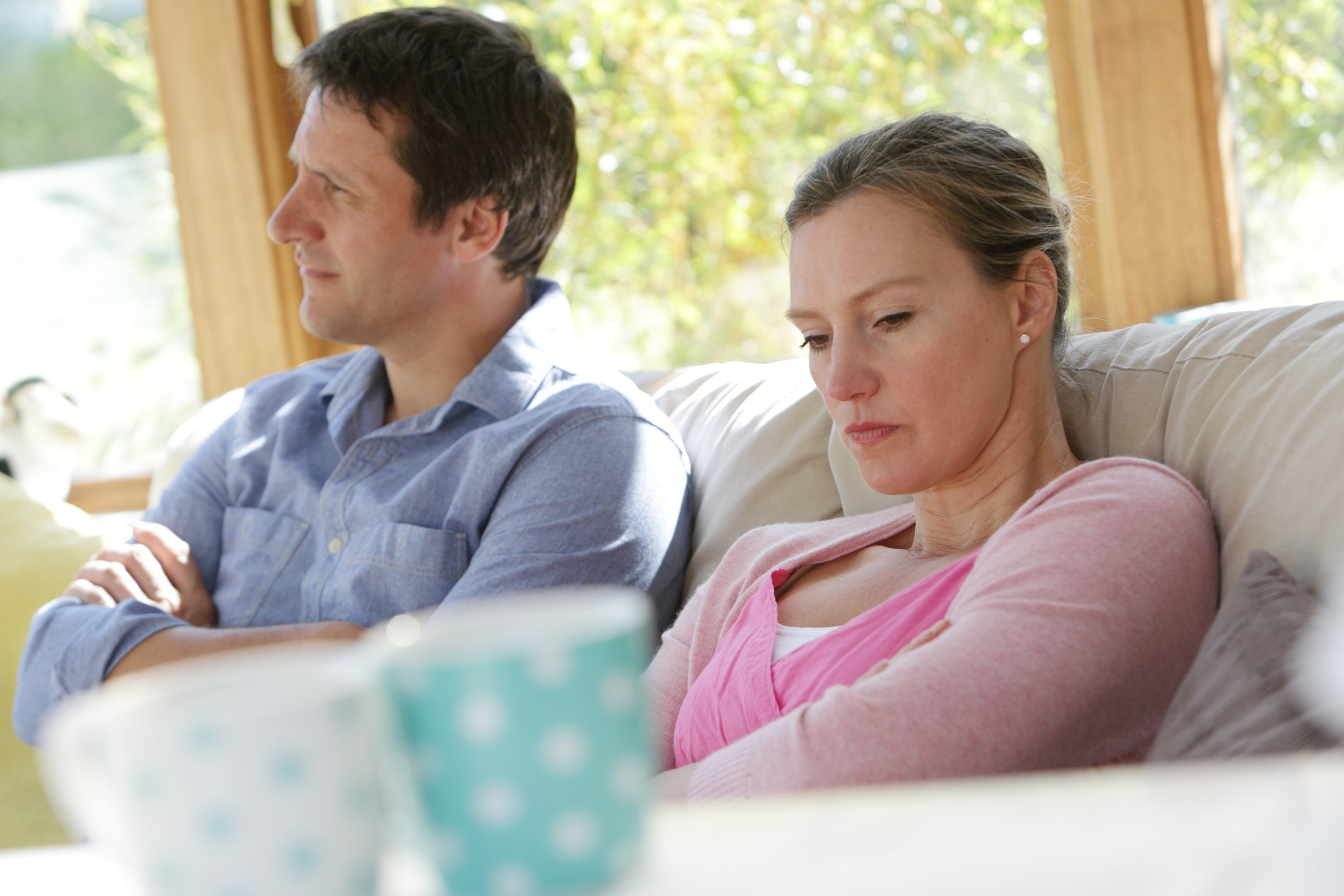 couple sat down looking angry