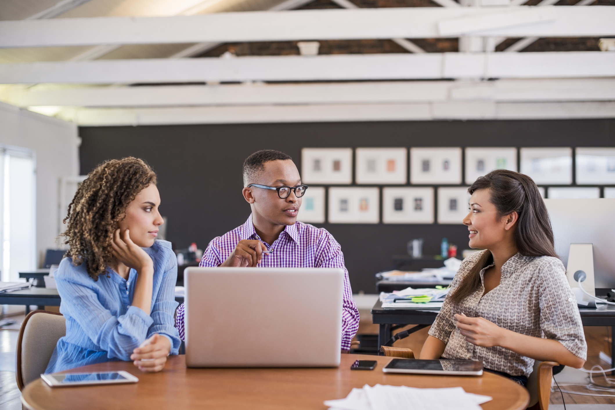 Businessman discussing with colleagues in office