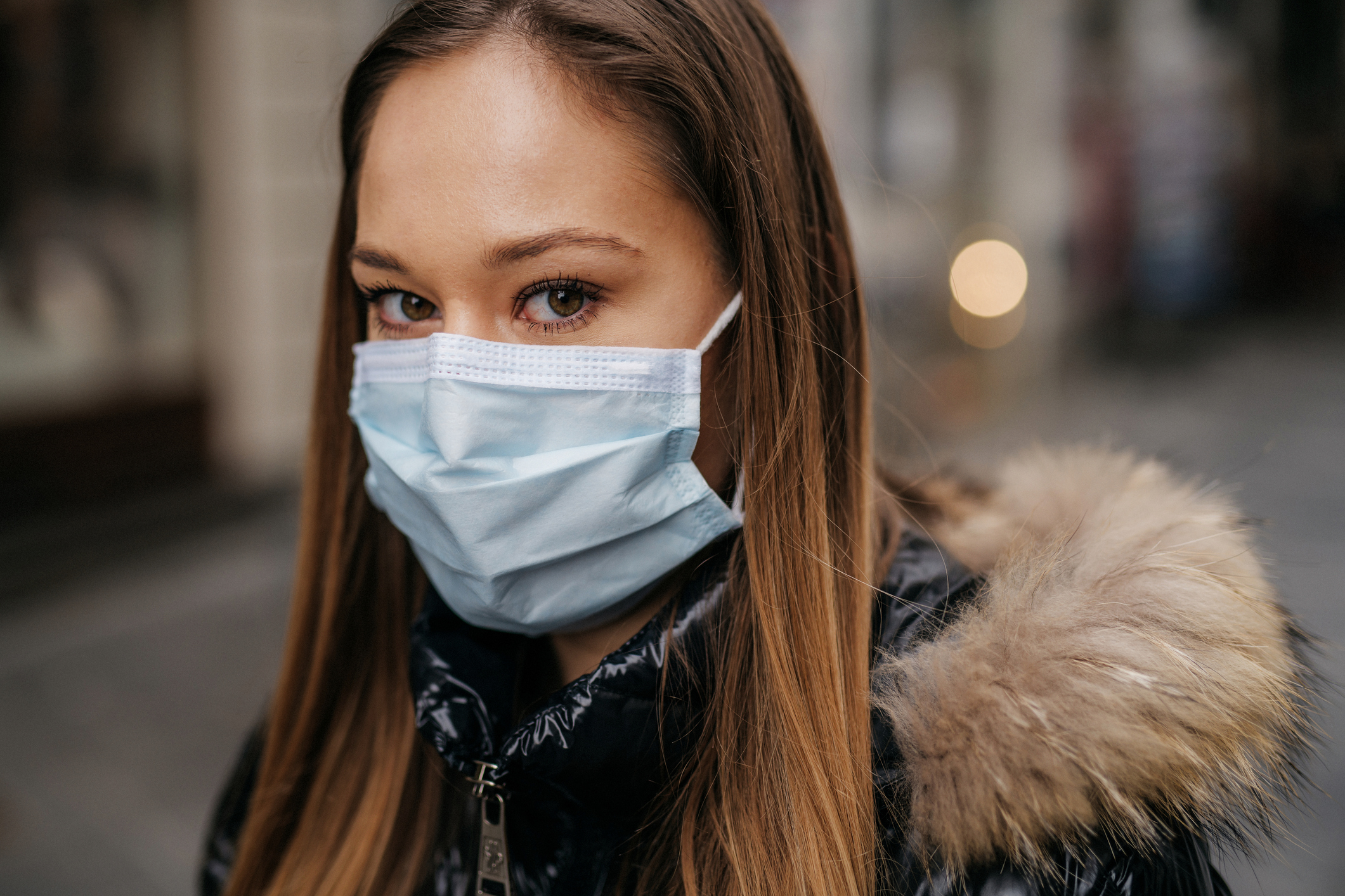 Portrait of a young woman wearing a face mask