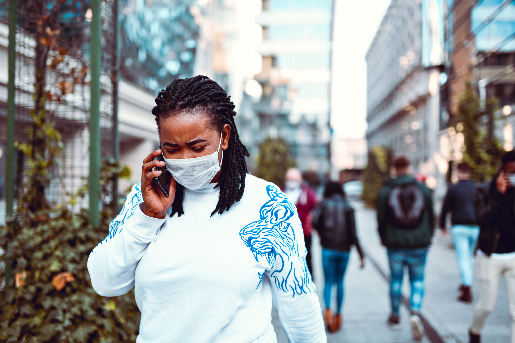 African Female With Surgical Mask Outside Using Phone During Coronavirus Outbreak