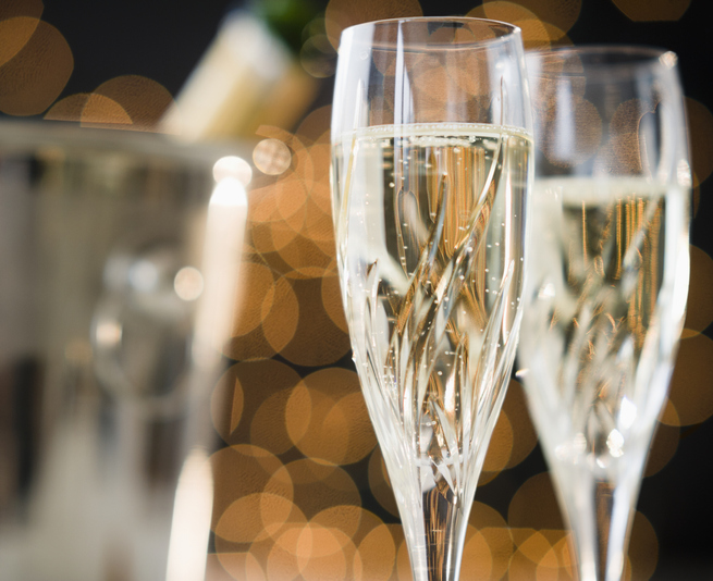 Close up of champagne flutes and ice bucket