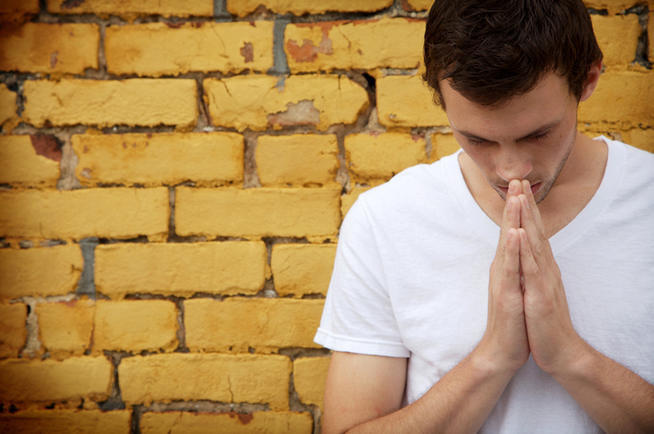 yellow brick wall prayer portraits
