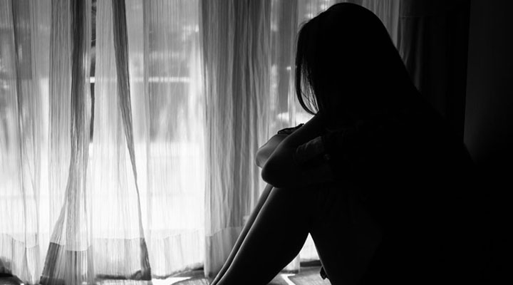 black and white of sad woman hug her knee and cry. Sad woman sit