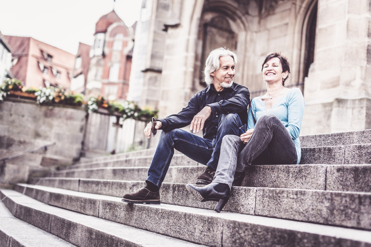 Senior couple taking a rest next to church, Tübingen, Germany