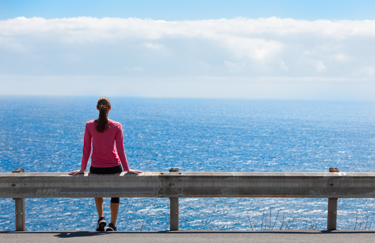 Woman enjoying beautiful ocean view