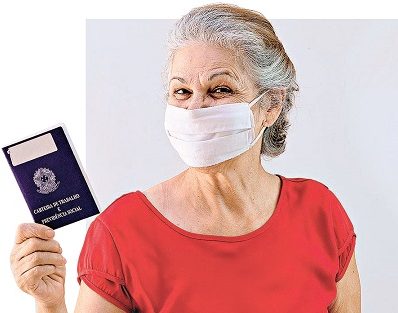 Mature Woman with pandemic mask  holding a Brazilian work card