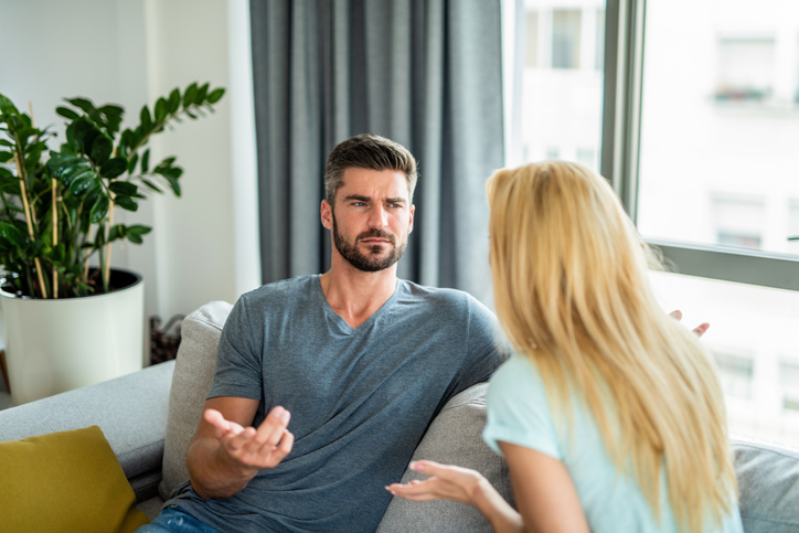 Young couple having an argument at home.