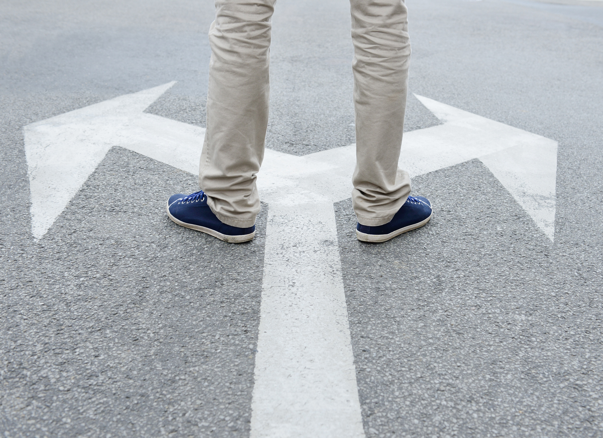 Man standing hesitating to make decision