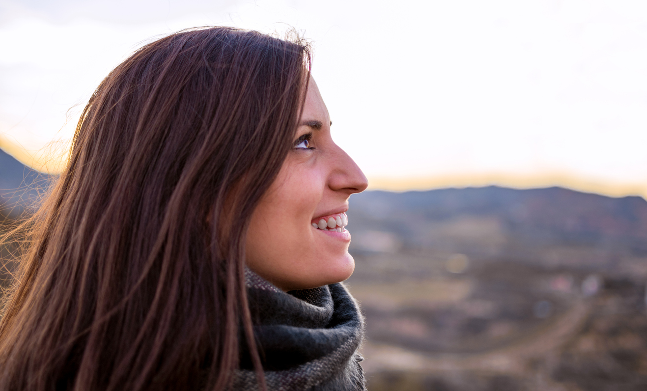 Young attractive woman laughing with big mouth