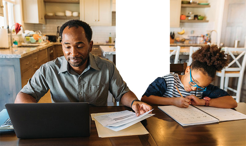 Man Working On Home Finances