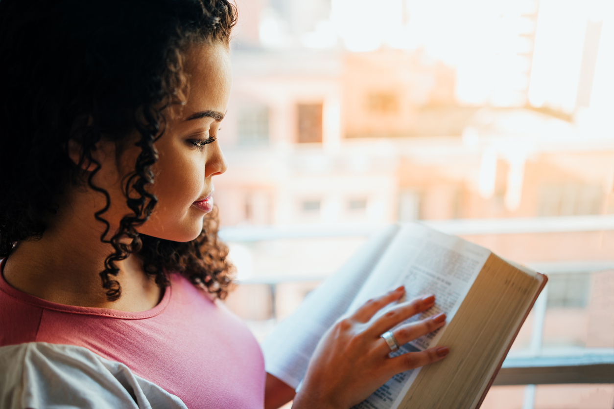 Woman reading the bible