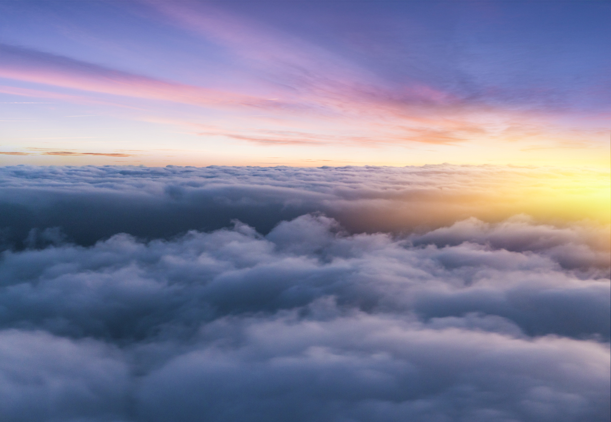 Beautiful sunset sky above clouds with nice dramatic light.