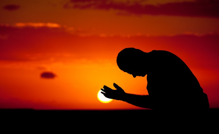 man-in-prayer-panorama-silhouette-picture-id497892997