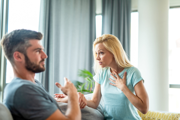 Young woman having an argument with her boyfriend.