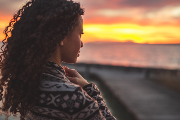 Thoughtful evening mood with a young afro latino woman