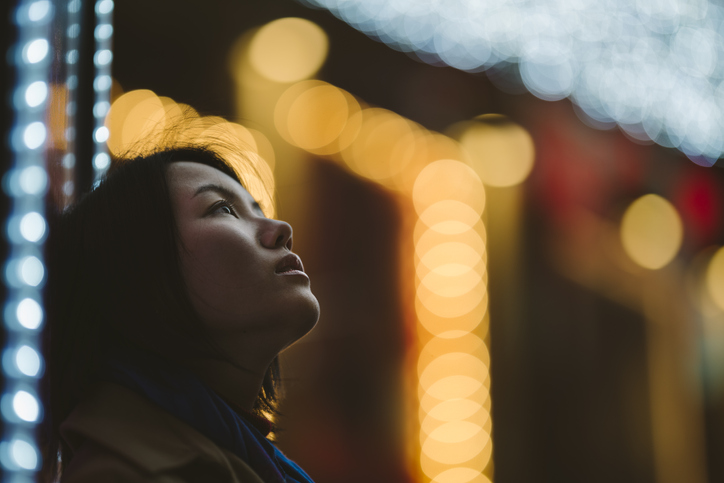 Portrait of young woman at night