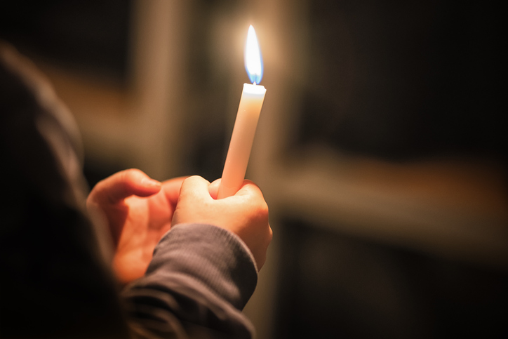 Kids are handling candles in the traditionall dresses. Celebration of Lucia day in Sweden.