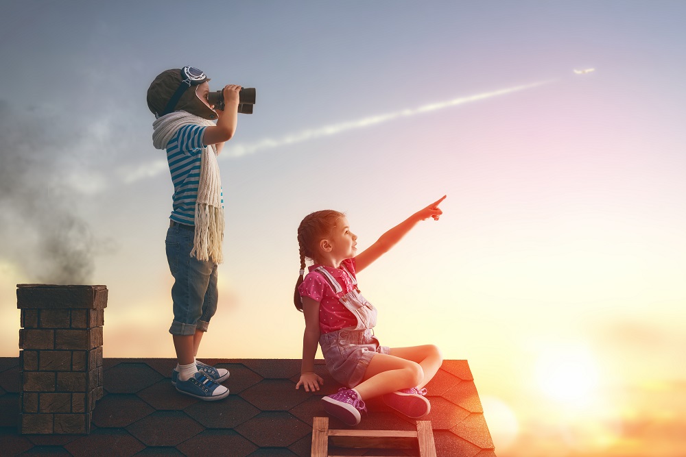 Two,Little,Children,Playing,On,The,Roof,Of,The,House