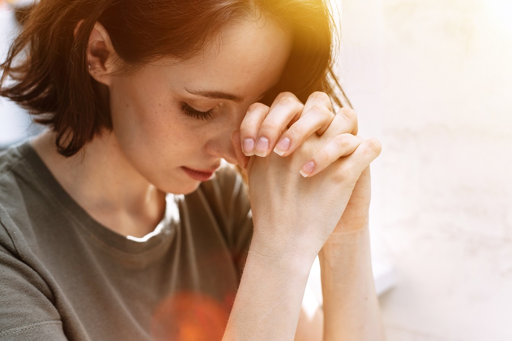 Cute,Beautiful,Girl,Folded,Her,Hands,In,Prayer.,A,Woman