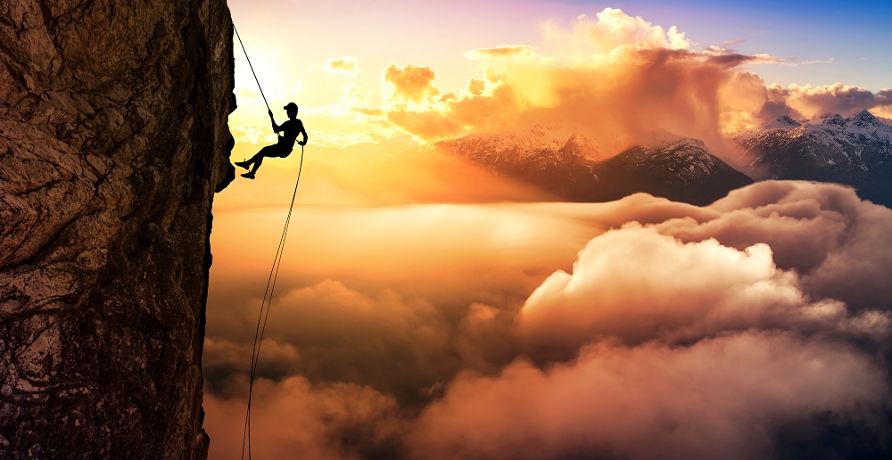 Silhouette,Rappelling,From,Cliff.,Beautiful,Aerial,View,Of,The,Mountains