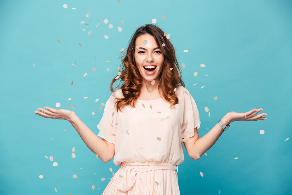 Portrait,Of,A,Cheerful,Beautiful,Girl,Wearing,Dress,Standing,Standing