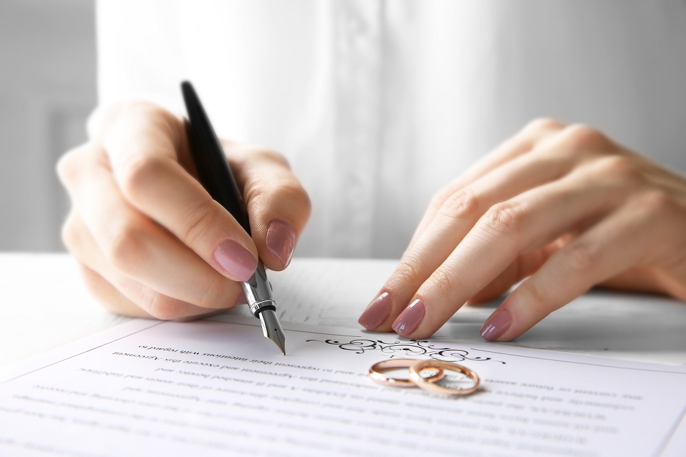 Woman,Signing,Marriage,Contract,,Closeup