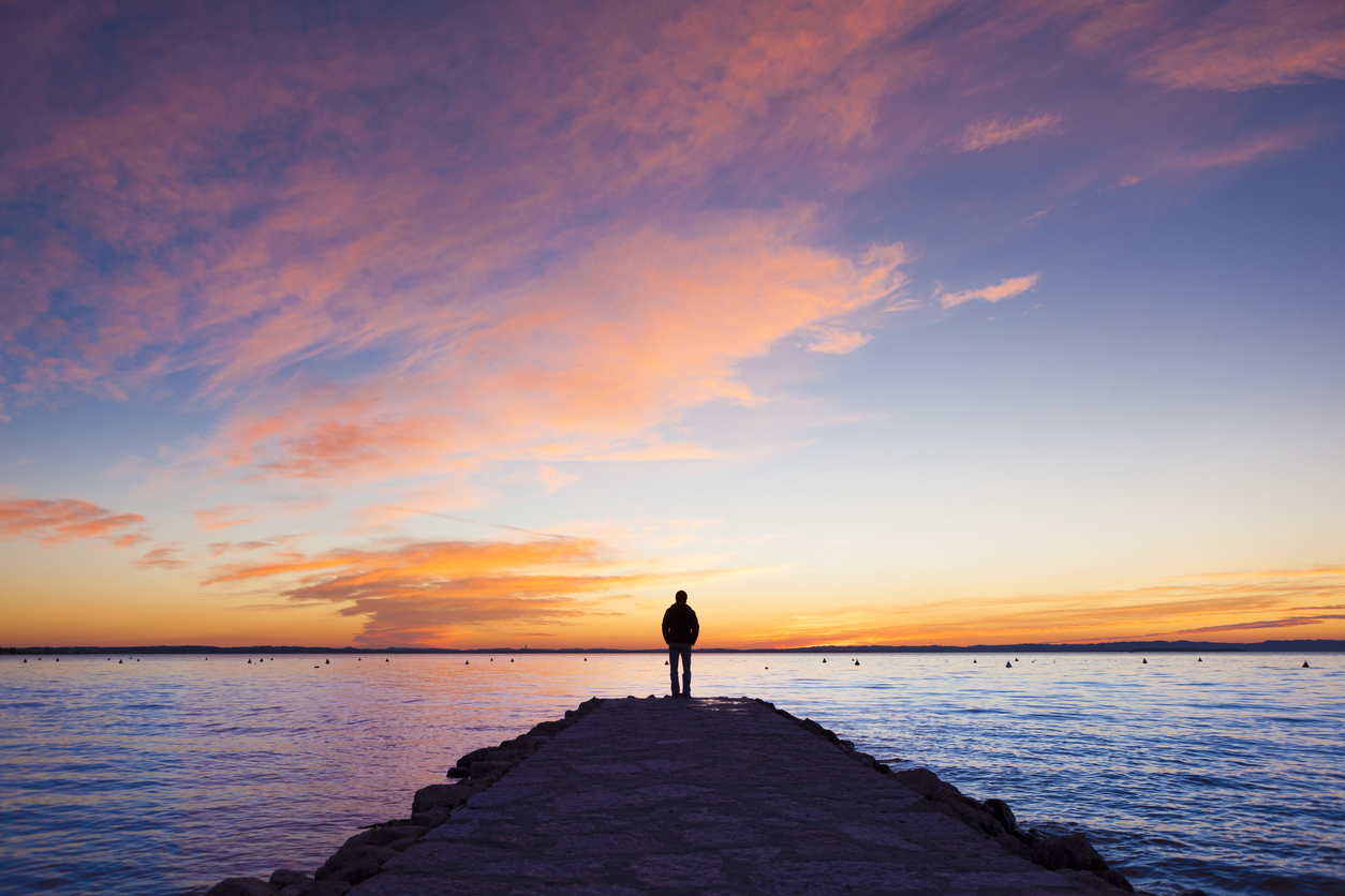 Man standing on jetty