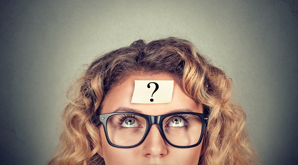 Thinking,Woman,With,Question,Mark,On,Gray,Wall,Background