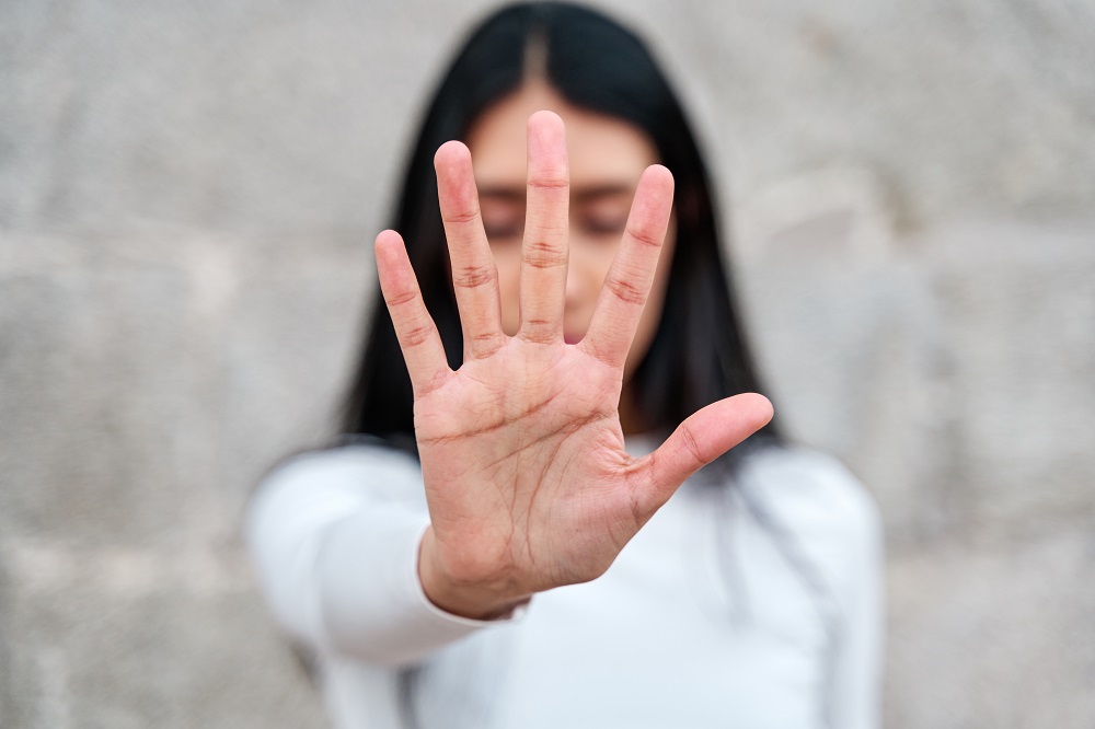 Woman,Raises,Her,Hand,To,Say,Enough,Is,Enough.,Campaign