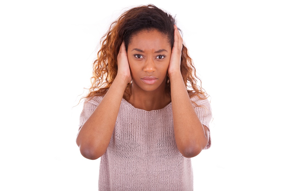 Young,African,American,Covering,Her,Ears,With,Her,Hands,Isolated