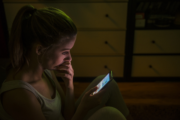 Woman looking and wondering she must call on the phone