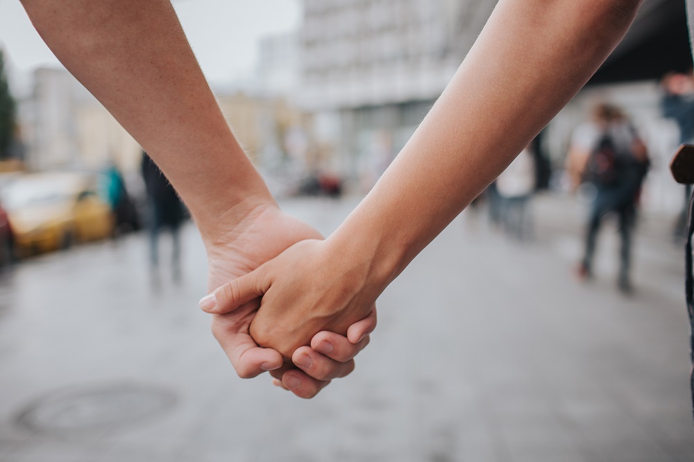 Couple,Hands,Closed,Together,Outdoors,In,Love,And,Romantic,Relationship.