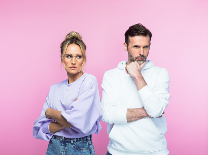 Angry mid adult couple looking away